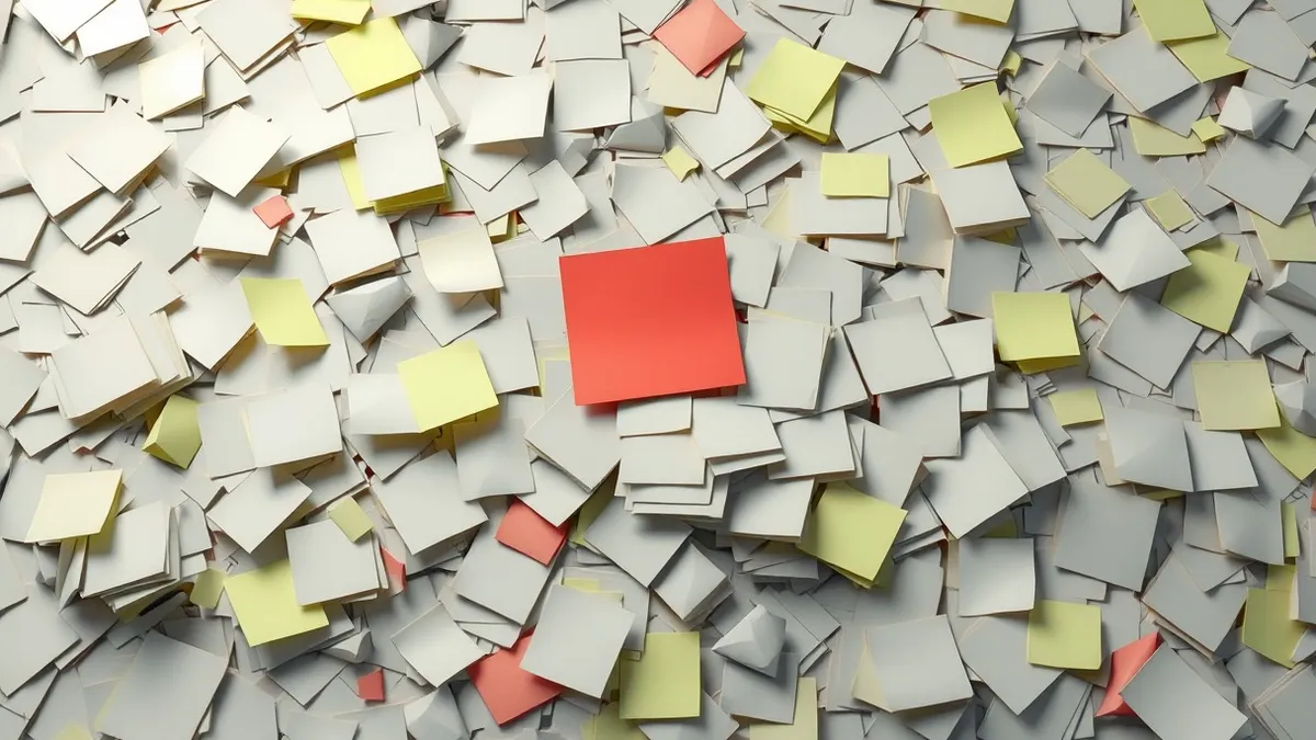Illustration: A cluttered desk surface covered in dozens of blank sticky notes and scattered paper scraps.
